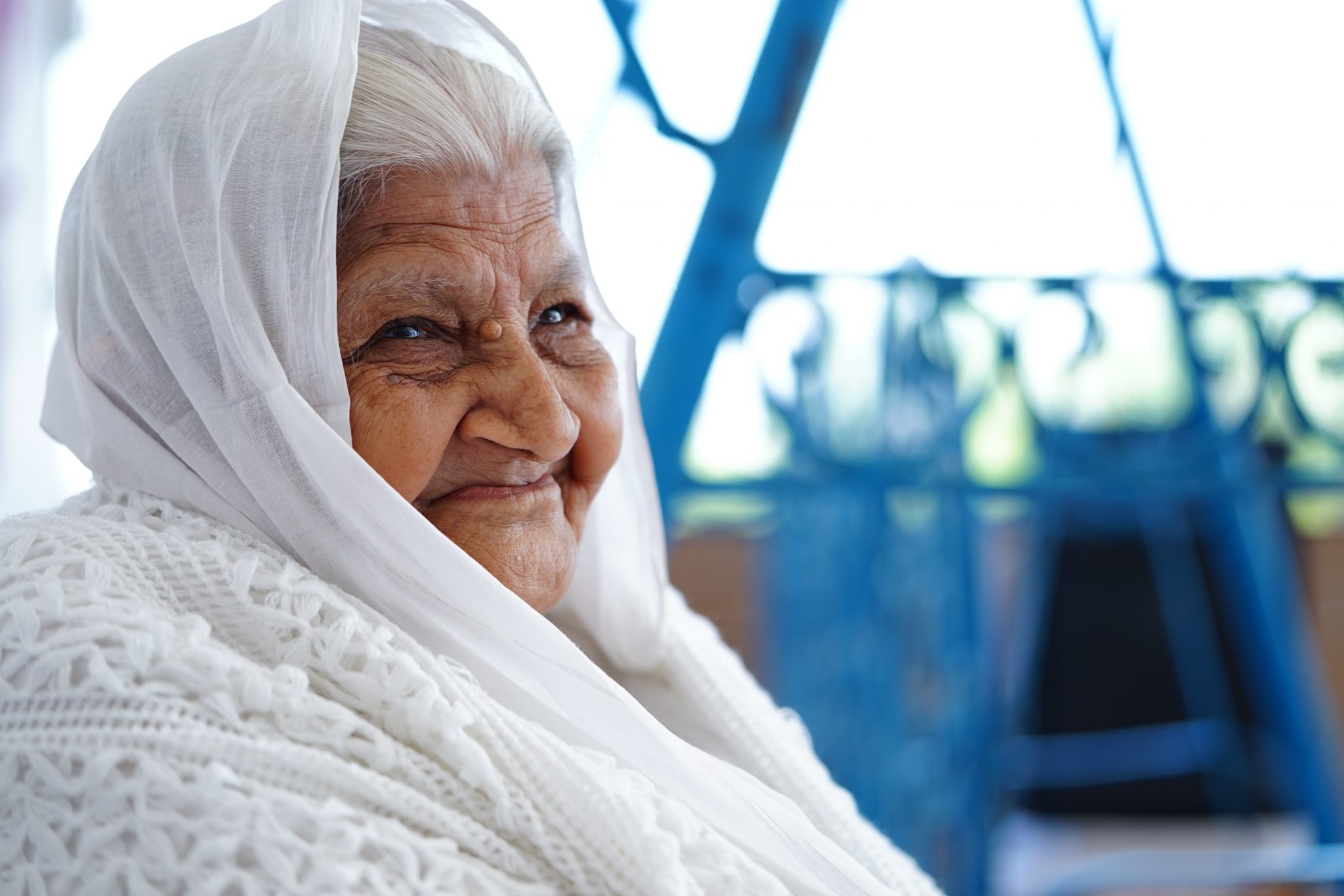 close-up photo of woman sitting while smiling
