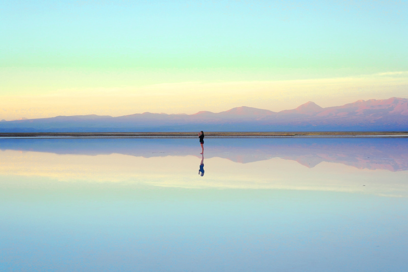 person standing near body of water during daytime