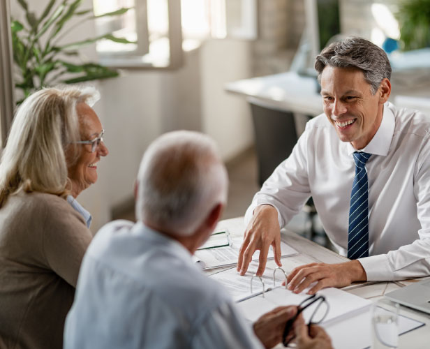 Financial advisor talking with clients